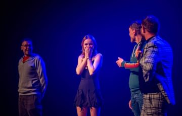 Four people on stage that were picked from the audience in a variety act
