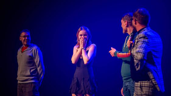 Four people on stage that were picked from the audience in a variety act