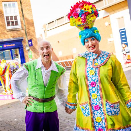 Jack and the Beanstalk panto cast members Ben Thornton as Billy and Sam Rabone as Dame Trot standing outside of the Box Office entrance