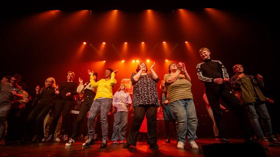 Audience members on stage during the Sam Rabone Big Bostin' Variety Show